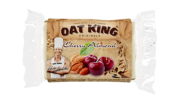 Oat King Riegel Verpackung, Sorte Cherry Almond, braun-beige, Produktname und Nährwertangaben sichtbar.