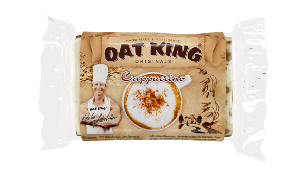 Oat King Riegel Verpackung, braun-beige, Produktname, Sorte Cappuccino, vegetarisch, Nährwertangaben sichtbar.